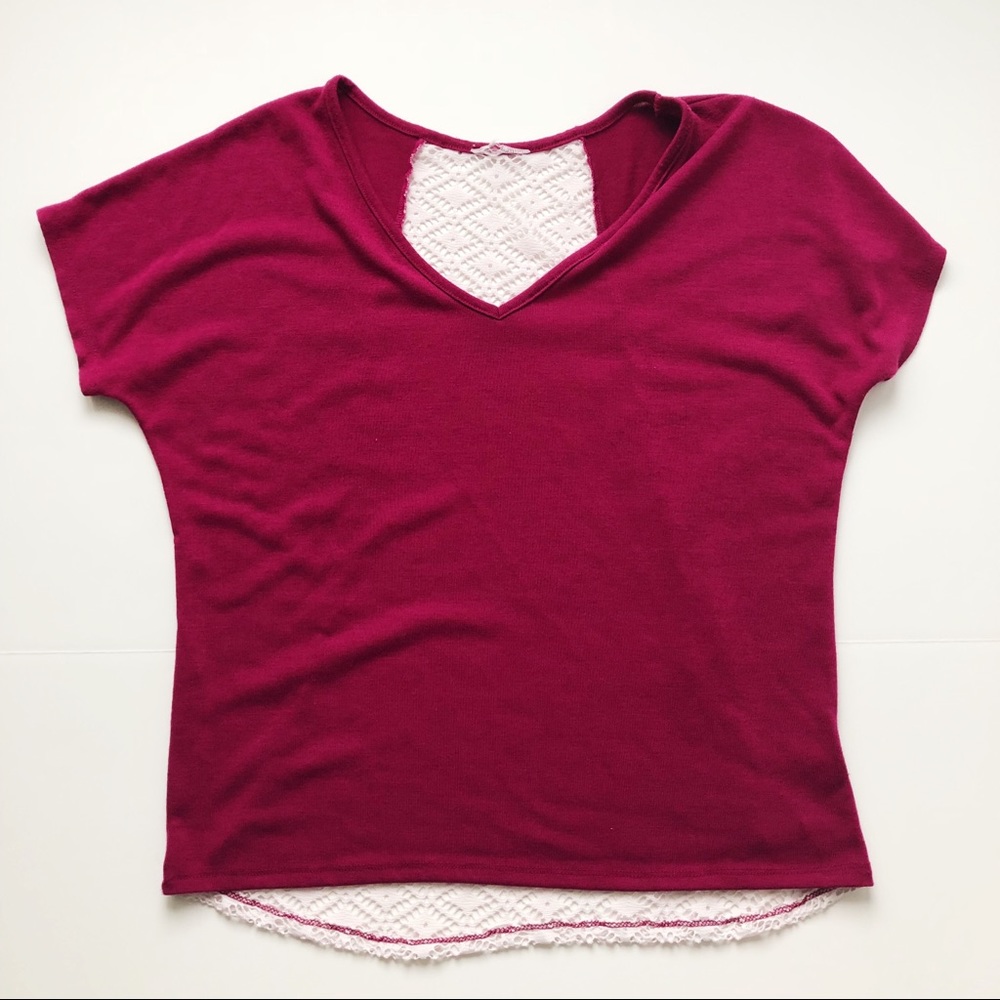 Magenta T-shirt with lace detail in the back.